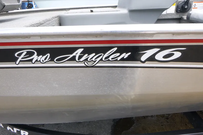 Slide: The Image of 2011 Tracker Pro Angler 16 boat with sleek black and red detailing. - 15