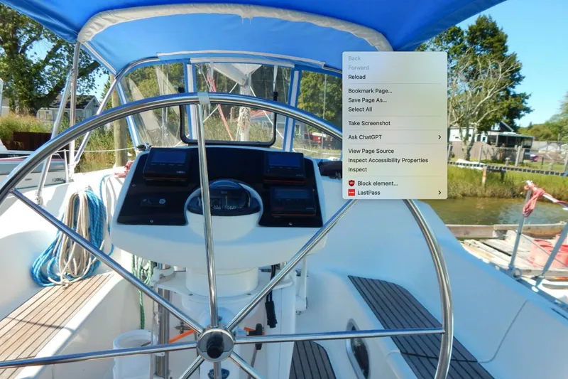 Slide: The Image of Steering wheel of 1997 Jeanneau Sun Odyssey 36.2 with blue cover. - 1