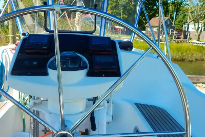 Slide: The Image of Steering wheel and cockpit of 1997 Jeanneau Sun Odyssey 36.2 sailboat. - 2
