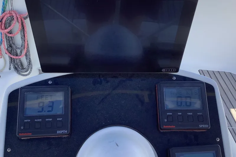 Slide: The Image of Control panel of 1997 Jeanneau Sun Odyssey 36.2 sailboat showing depth and speed gauges. - 24