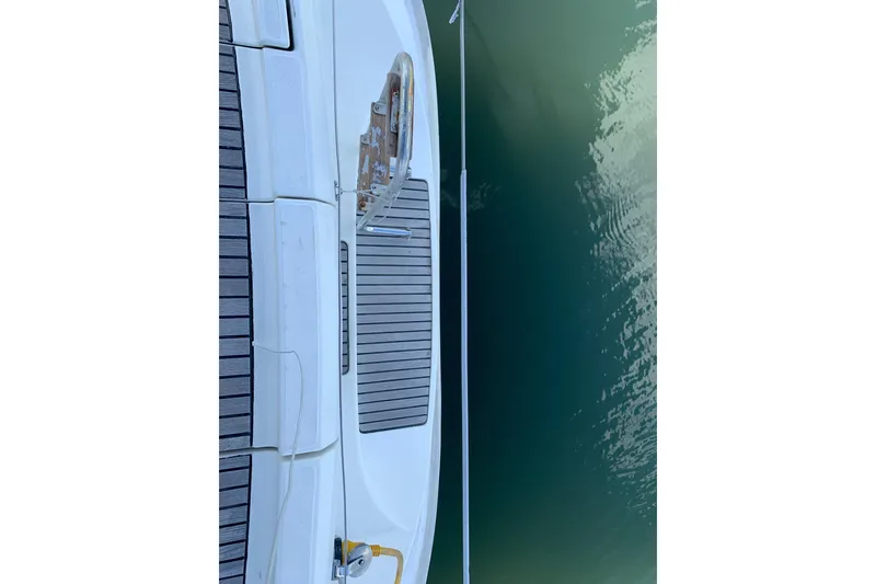 Slide: The Image of Jeanneau Sun Odyssey 36.2 yacht deck, 1997 model, docked by calm water. - 25