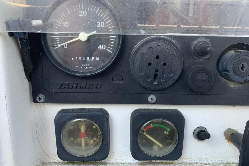 Slide: The Image of Control panel of a 1997 Jeanneau Sun Odyssey 36.2 sailboat with Yanmar engine gauges. - 27