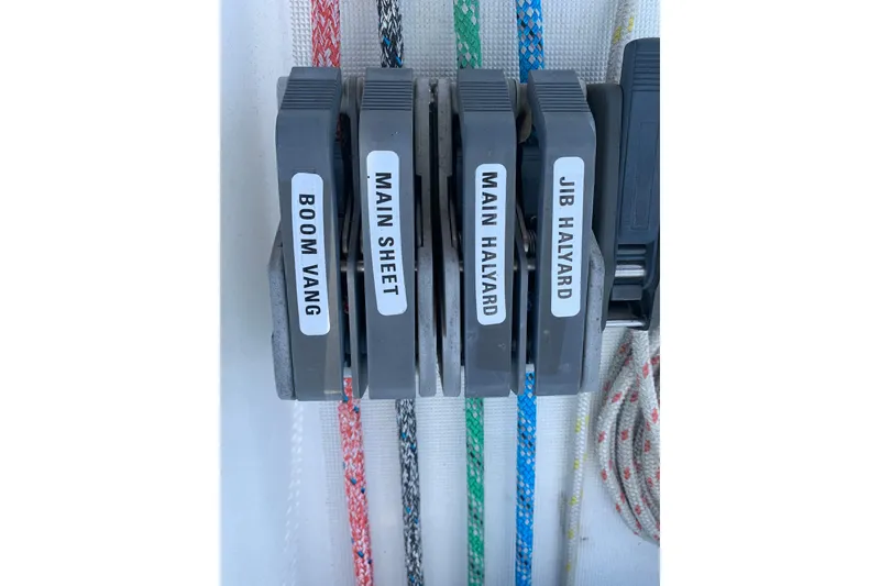 Slide: The Image of Close-up of labeled rope clutches on a 1997 Jeanneau Sun Odyssey 36.2 sailboat. - 29