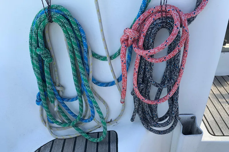 Slide: The Image of Colorful ropes on Jeanneau Sun Odyssey 36.2 sailboat, 1997 model, neatly coiled on deck. - 31