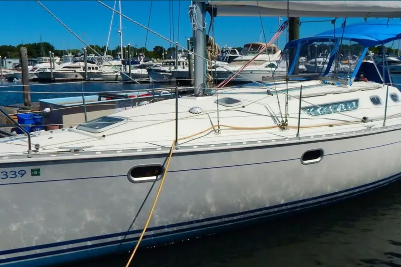Slide: The Image of 1997 Jeanneau Sun Odyssey 36.2 sailboat docked at a marina. - 35