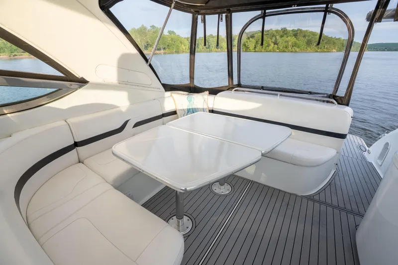 Slide: The Image of Interior of 2006 Formula 400 Super Sport yacht with seating and table, overlooking water. - 11