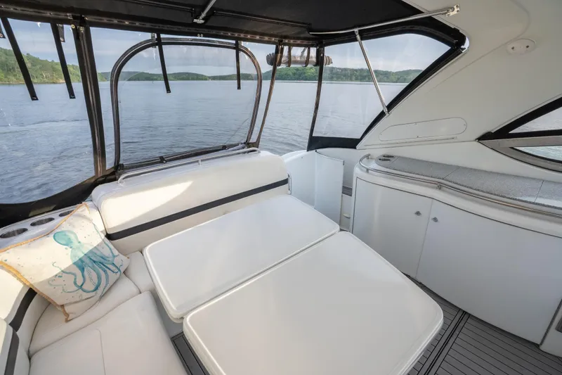 Slide: The Image of Interior of 2006 Formula 400 Super Sport yacht with white seating and lake view. - 12