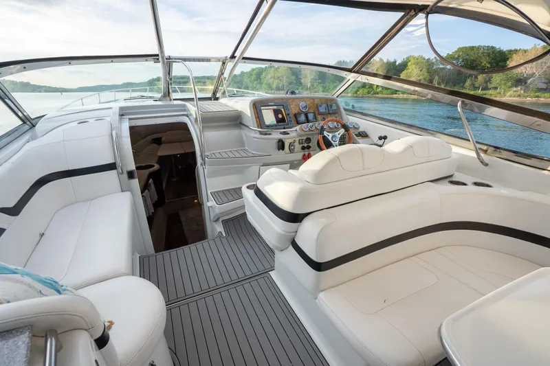 Slide: The Image of Luxurious 2006 Formula 400 Super Sport yacht interior with sleek white seating and modern dashboard. - 14
