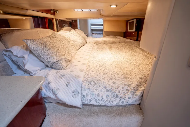 Slide: The Image of Luxurious cabin interior of a 2006 Formula 400 Super Sport yacht with elegant bedding. - 25