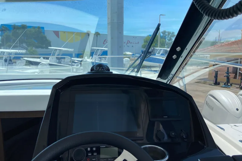 Slide: The Image of 2024 Jeanneau NC Weekender 895 Series 2 helm with navigation controls and windshield view. - 14