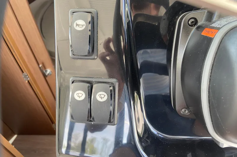 Slide: The Image of Control panel of 2024 Jeanneau NC Weekender 895 Series 2 boat with switches. - 16