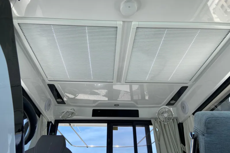 Slide: The Image of Interior view of 2024 Jeanneau NC Weekender 895 Series 2 with skylight and seating. - 21