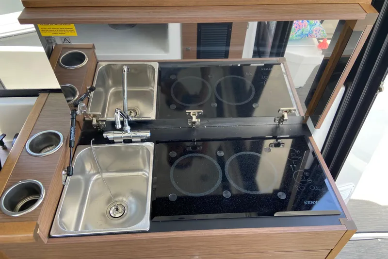 Slide: The Image of Modern kitchen area in 2024 Jeanneau NC Weekender 895 Series 2 boat. - 26