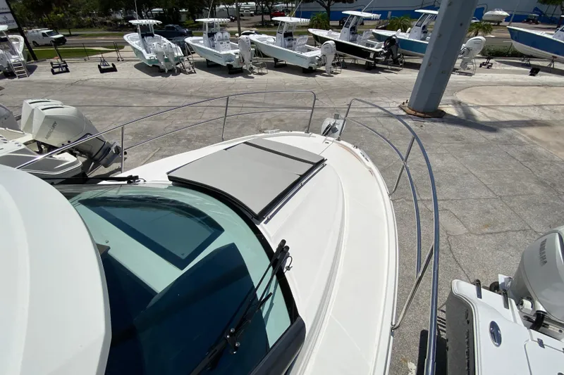Slide: The Image of 2024 Jeanneau NC Weekender 895 Series 2 boat on display at a marina. - 33