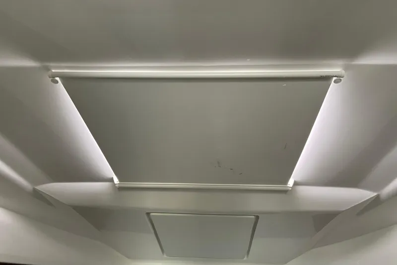 Slide: The Image of Ceiling view of 2024 Jeanneau NC Weekender 895 Series 2 with a closed skylight shade. - 38