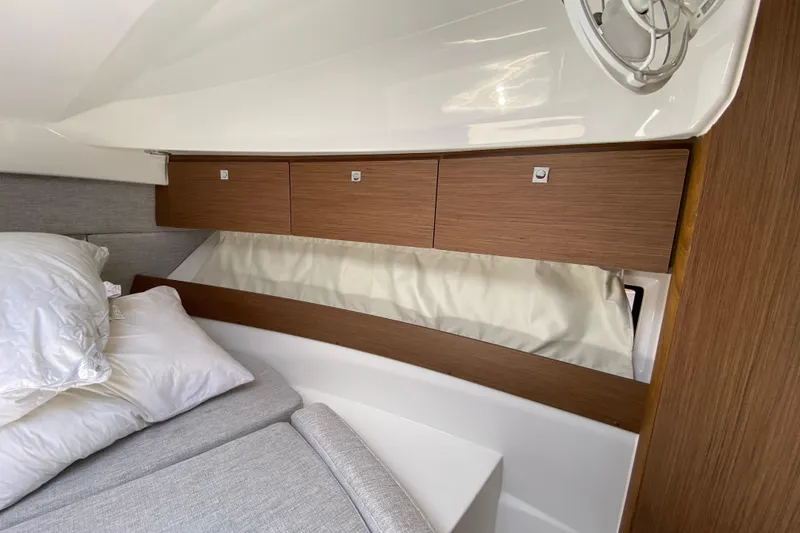 Slide: The Image of 2024 Jeanneau NC Weekender 895 Series 2 cabin interior with wooden storage cabinets. - 44