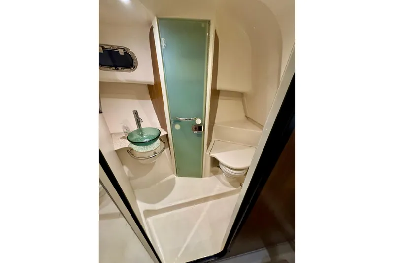 Slide: The Image of Luxurious bathroom in 2014 Pursuit OS 345 Offshore boat with modern fixtures and glass sink. - 21