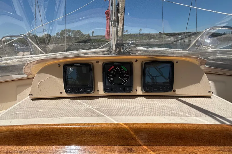 Slide: The Image of Cockpit instruments of a 2015 Island Packet 370 sailboat under clear skies. - 22