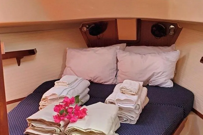 Slide: The Image of Cozy cabin interior of 2015 Island Packet 370 yacht with neatly arranged linens and flowers. - 37