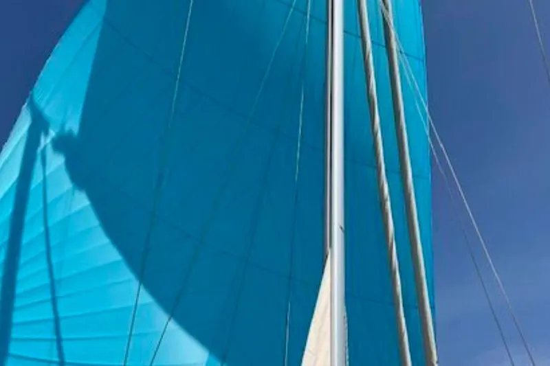 Slide: The Image of Blue sail of 2015 Island Packet 370 yacht against clear sky. - 46