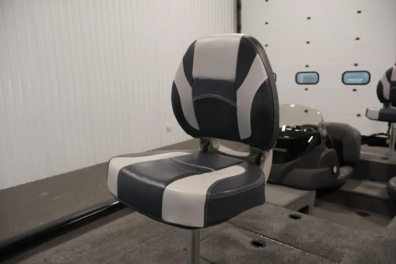 Slide: The Image of 2024 Tracker Pro 170 boat seat in a modern indoor setting. - 15