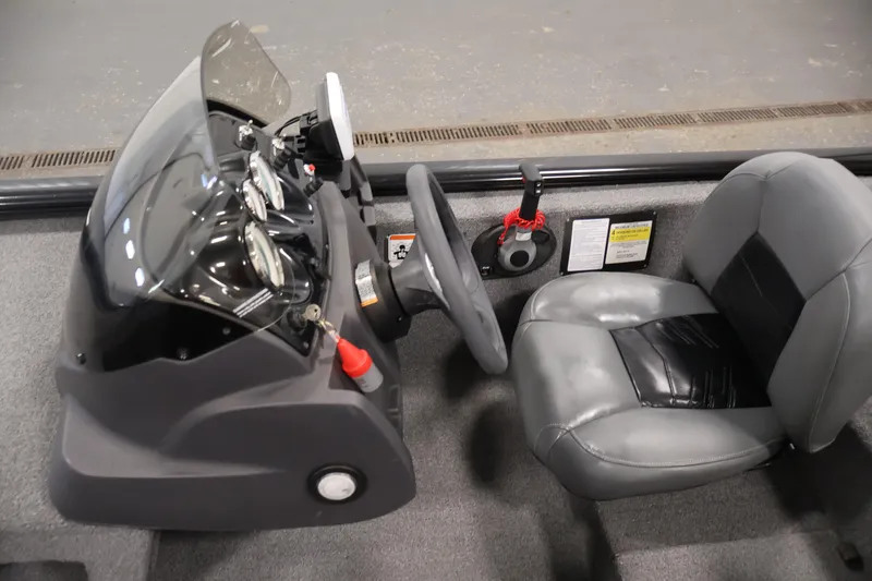 Slide: The Image of 2024 Tracker Pro 170 boat interior with steering console and seat. - 20