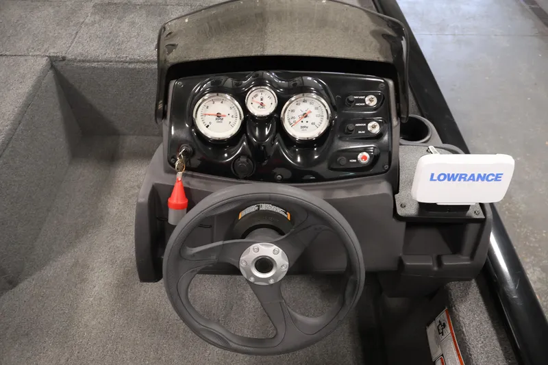 Slide: The Image of 2024 Tracker Pro 170 boat dashboard with steering wheel and Lowrance navigation system. - 21