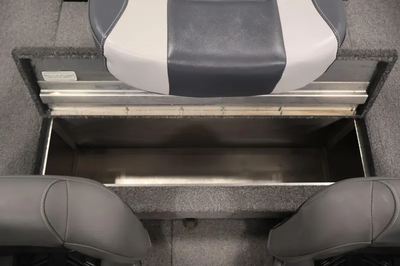 Slide: The Image of 2024 Tracker Pro 170 boat interior storage compartment with gray seating. - 31