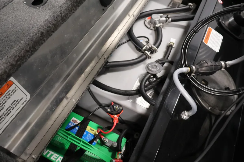 Slide: The Image of 2024 Tracker Pro 170 boat interior showing battery and fuel system components. - 32