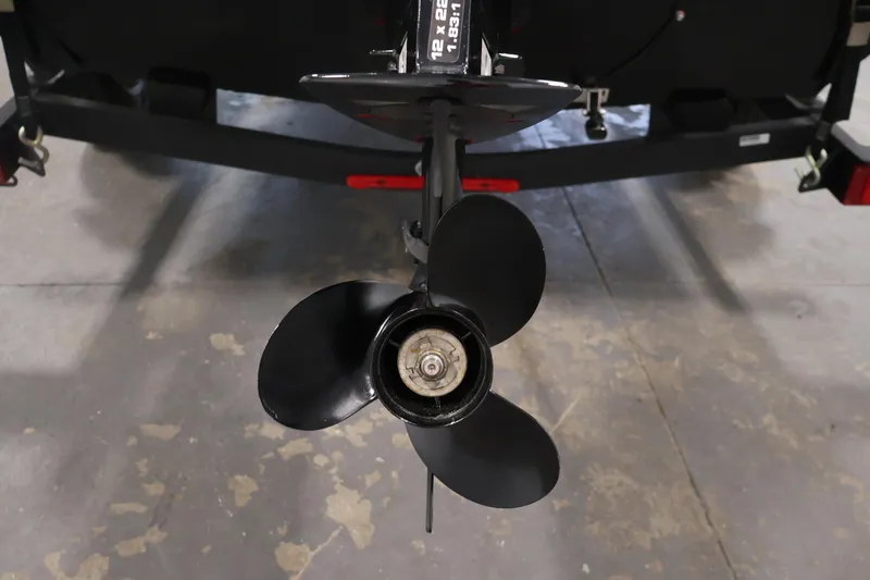 Slide: The Image of 2024 Tracker Pro 170 boat propeller on a trailer in a garage setting. - 36