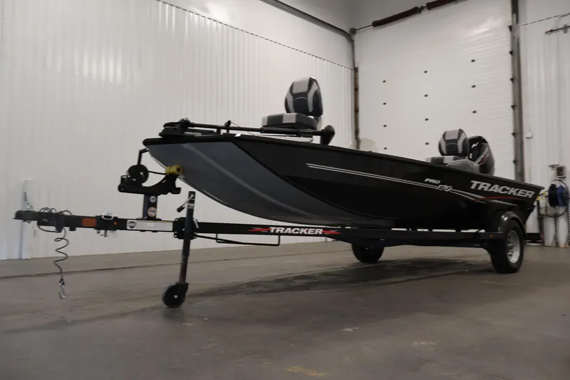 Slide: The Image of 2024 Tracker Pro 170 boat on trailer in indoor storage facility. - 38