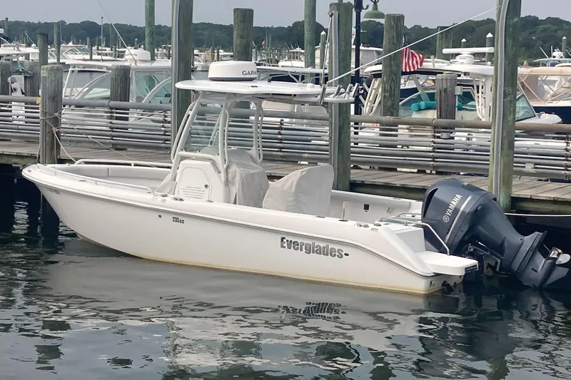 Slide: The Image of 2020 Everglades 235 Center Console boat docked with Yamaha outboard motor. - 1