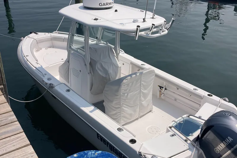 Slide: The Image of 2020 Everglades 235 Center Console boat docked, featuring Garmin equipment and Yamaha engine. - 8