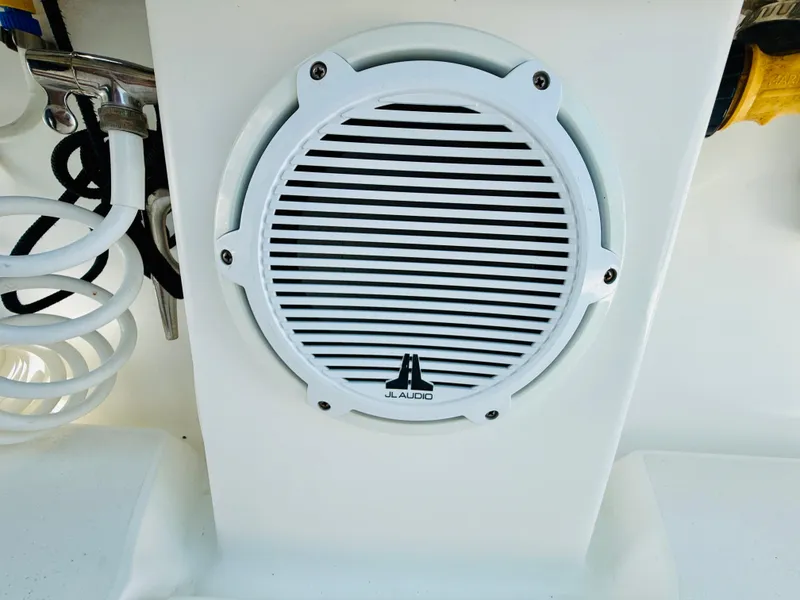 Slide: The Image of White JL Audio speaker on a 2003 Intrepid 377 boat. - 37