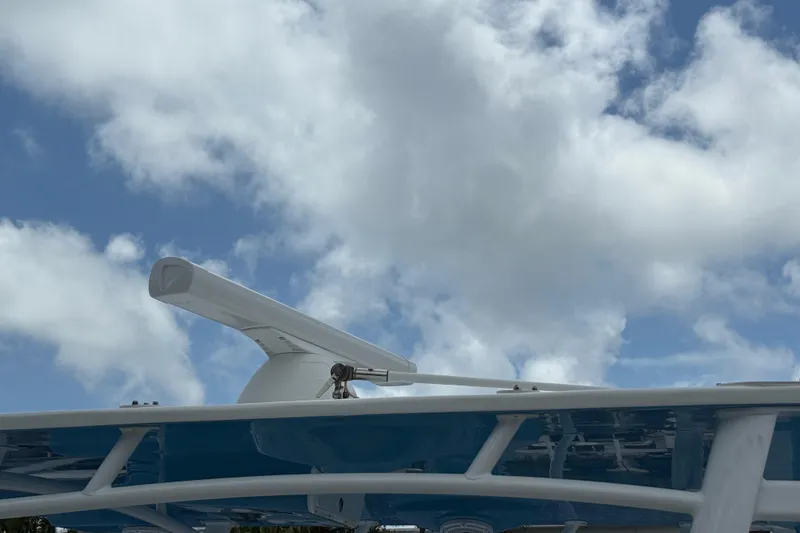 Slide: The Image of Radar equipment on a 2003 Intrepid 377 boat against a cloudy sky. - 44