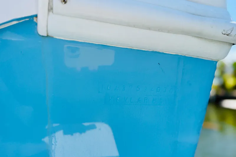 Slide: The Image of Close-up of a 2003 Intrepid 377 boat hull with embossed identification numbers. - 52