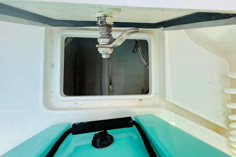 Slide: The Image of Open hatch on a 2003 Intrepid 377 boat, showing interior compartment details. - 65