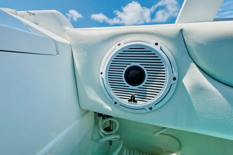 Slide: The Image of Speaker on a 2003 Intrepid 377 boat, set against a clear blue sky. - 66