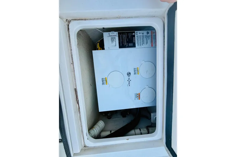 Slide: The Image of Electrical compartment of a 2003 Intrepid 377 boat, showing wiring and components. - 67