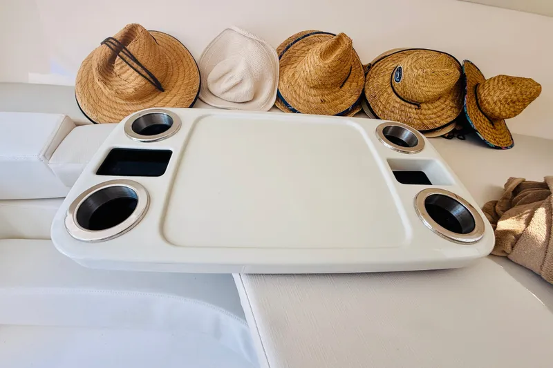 Slide: The Image of Boat interior with cup holders and straw hats, Intrepid 377, 2003 model. - 99