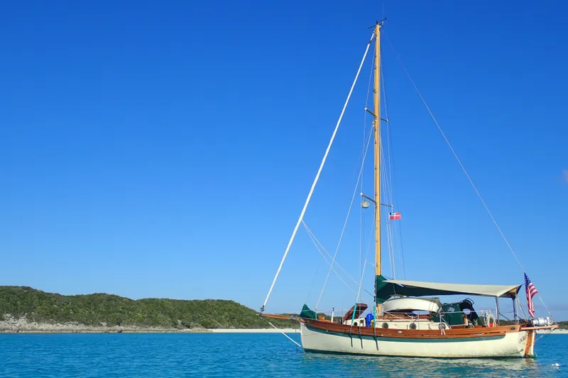 The Image of Sailboat Bristol Channel Cutter 1987 anchored in clear blue waters under a sunny sky. - 0