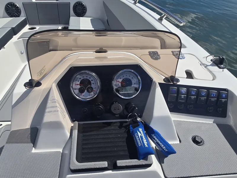 Slide: The Image of The dashboard of a Starcraft 181SVOB boat with gauges and switches. - 13