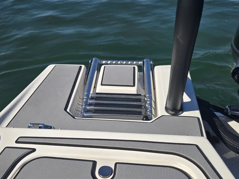 Slide: The Image of A swim platform with a retractable ladder at the stern of a boat, surrounded by water. - 8