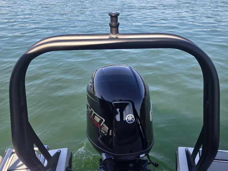 Slide: The Image of An outboard motor on a boat in calm water. - 7
