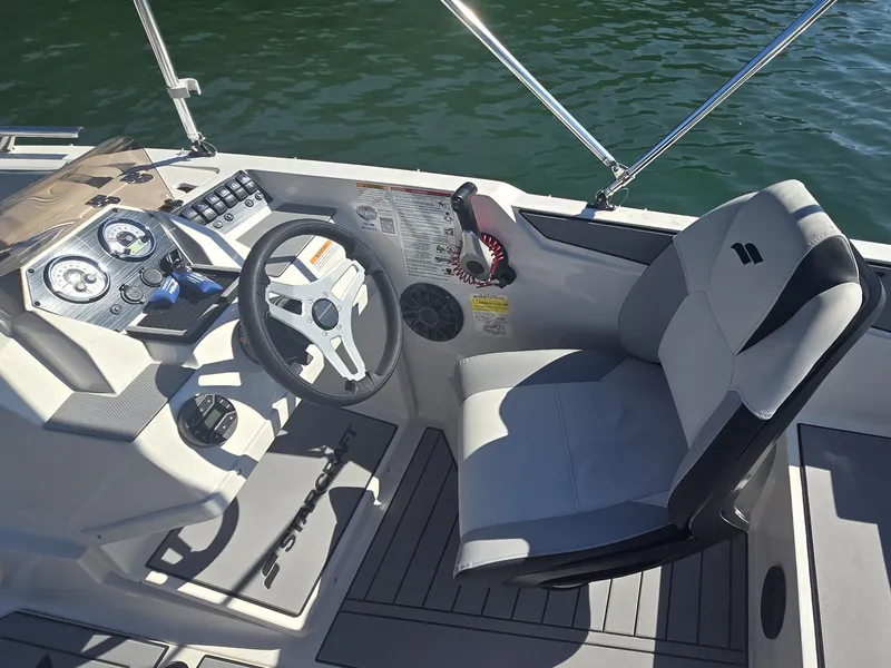 Slide: The Image of The cockpit of a 2027 Starcraft 181SVOB with a modern steering wheel and instruments. - 10