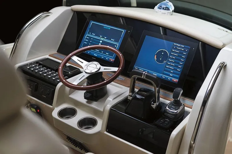 Slide: The Image of Manufacturer Provided Image: 2018 Chris-Craft Catalina 34 helm with dual navigation screens and modern controls. - 5