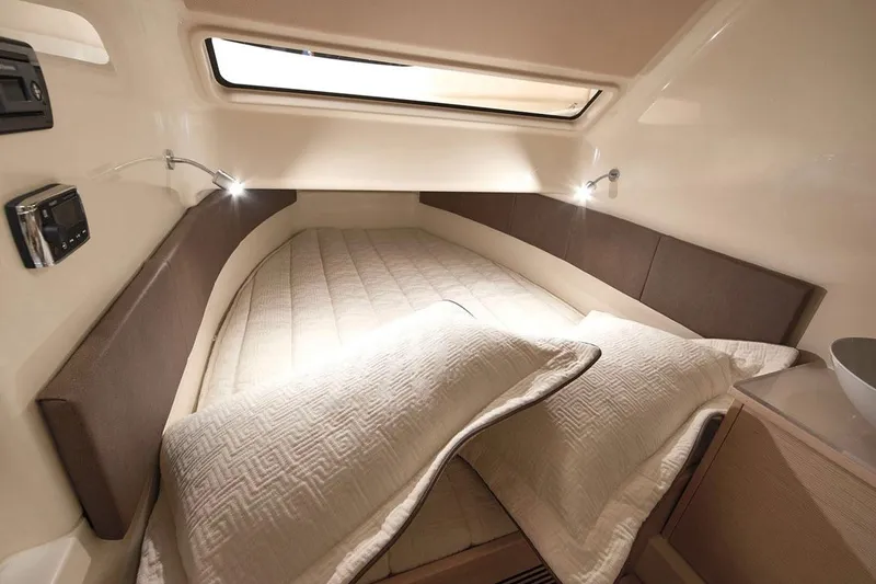 Slide: The Image of Manufacturer Provided Image: 2018 Chris-Craft Catalina 34 cabin interior with cozy bed and modern lighting. - 7