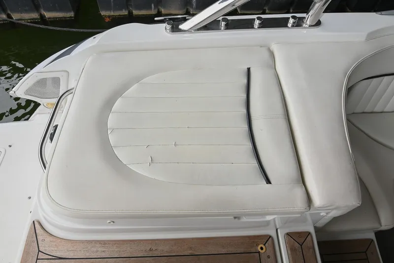 Slide: The Image of White leather seating on a 2005 Cobalt 262 boat, featuring wood accents. - 10