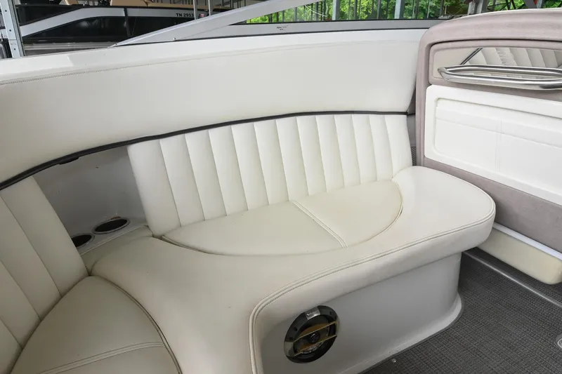 Slide: The Image of Luxurious white seating in a 2005 Cobalt 262 boat interior. - 18