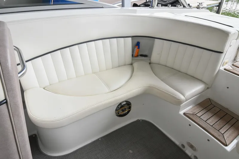 Slide: The Image of Interior seating of a 2005 Cobalt 262 boat with white upholstery. - 20